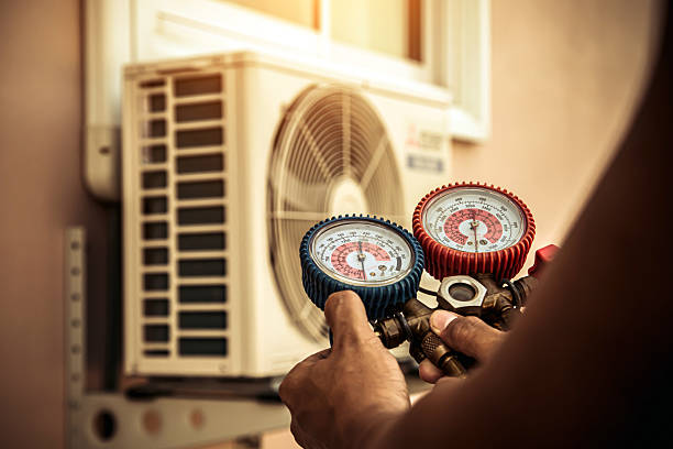 Professional Air Conditioning Service technician working in Lakeville, MN